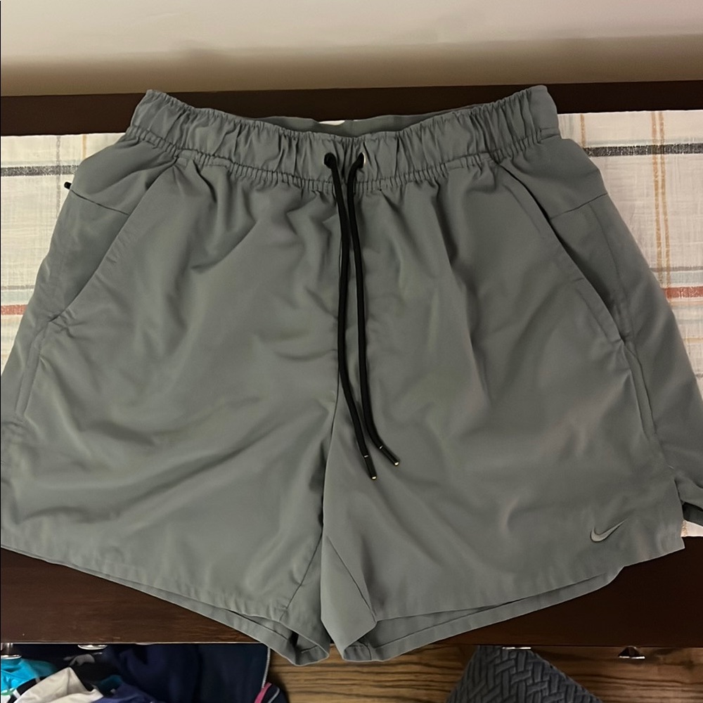 Nike Gray Athletic Shorts with Drawstring and back zipper pocket for wallet.